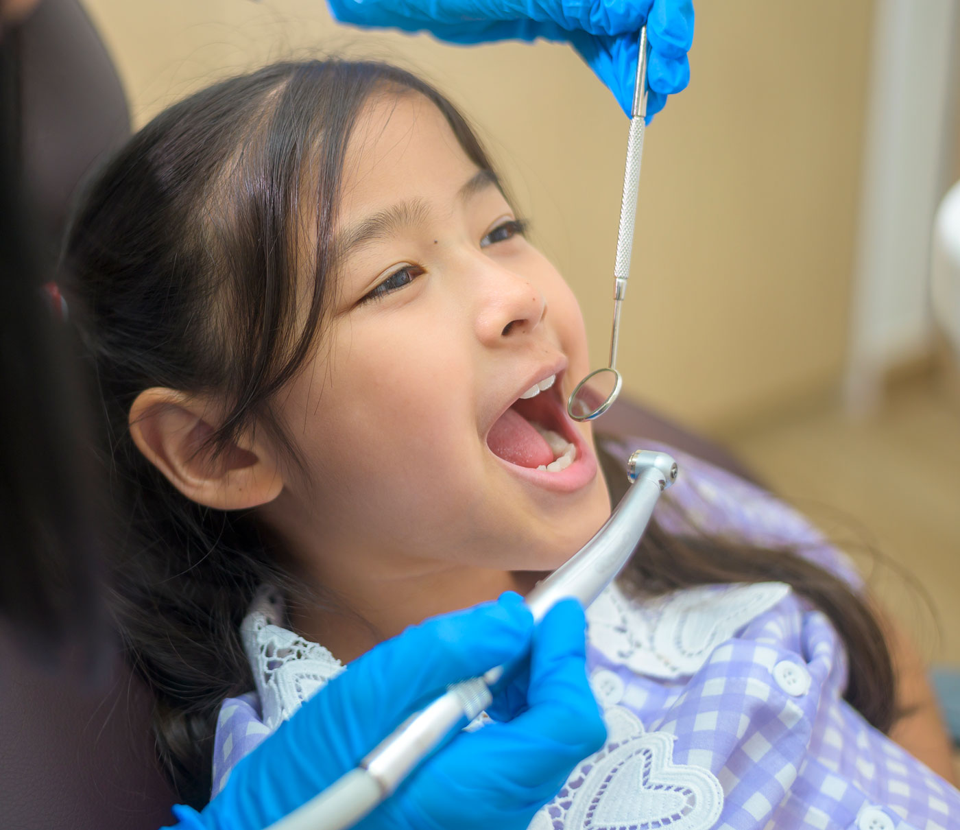 young female patient with dentist