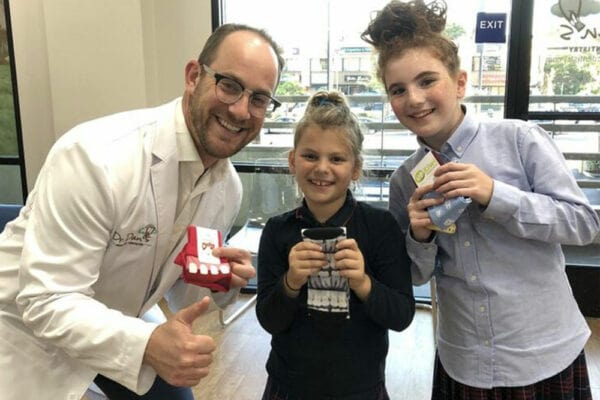 dr dan smiling with patients